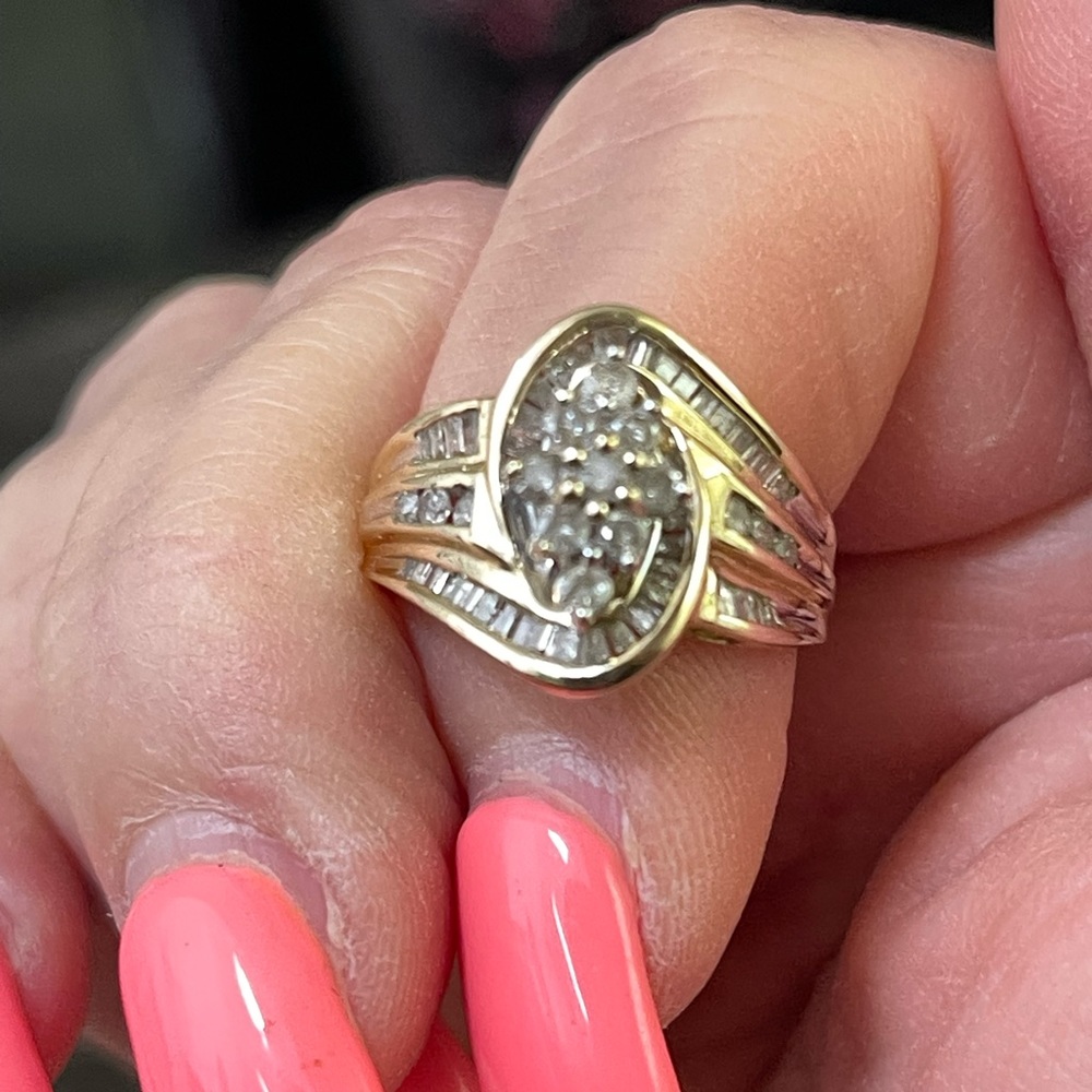 Diamond ring size 7 10 kt round and Chanel set stones.